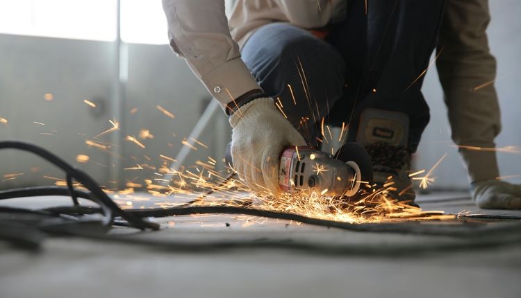 Worker Using an Angle Grinder